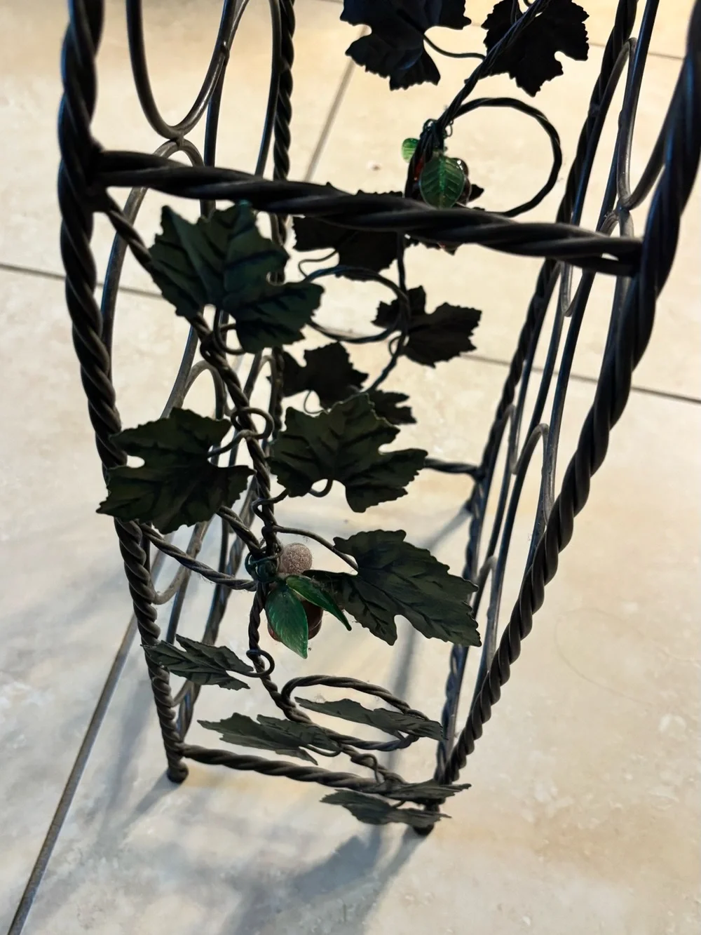 Black Metal Wine Bottle Rack with Decorative Leaf Accents